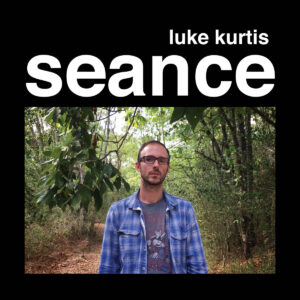 cover of "seance" EP featuring a photo of the artist standing in the woods looking directly at the camera
