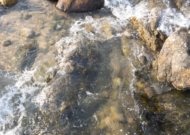 water crashing against rocks